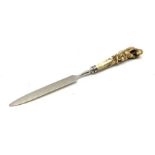 Edwardian silver and bone letter opener, the handle finely carved as a Monkey gathering fruit by Jam