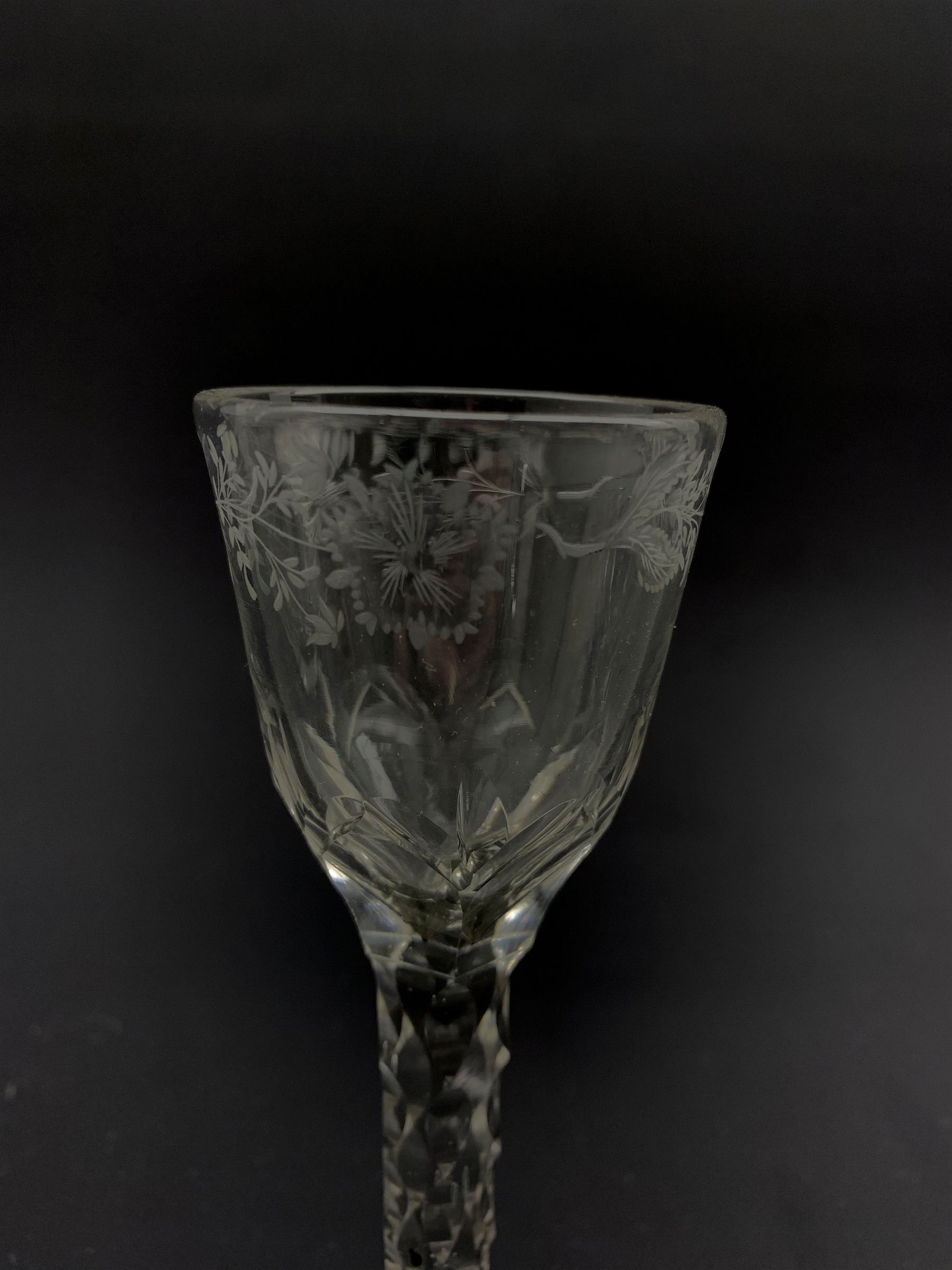 Set of three 18th century wine glasses, the ovoid bowls engraved with flower sprigs on faceted stems - Image 2 of 4