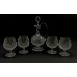 Waterford crystal claret decanter with certificate and four Waterford Crystal Lismore pattern brandy