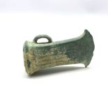 Bronze Age axe head with short curved blade and ribbed design with projecting loop handle L9cm