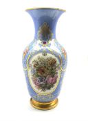 19th century French porcelain baluster vase painted with panels of flowers on a blue and gilt ground