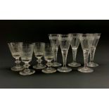 Set of three19th century wine glasses, the bucket shaped bowls engraved with the initials M.W within