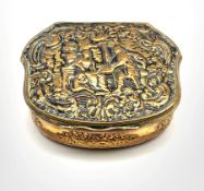 19th century gilt metal box of serpentine outline, the hinged cover embossed with figures W7cm