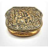 19th century gilt metal box of serpentine outline, the hinged cover embossed with figures W7cm