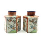 Pair of Chinese hexagonal tea canisters decorated with panels of landscapes and birds, H11cm