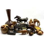 Collection of turned wooden items including a bottle shaped vase with fluted carved decoration, turn
