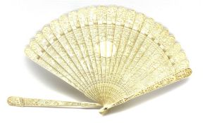 19th century Chinese Canton carved ivory brise fan: each pierced stick intricately carved on one sid