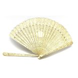 19th century Chinese Canton carved ivory brise fan: each pierced stick intricately carved on one sid