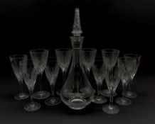 Part suite of Stuart Crystal Lichfield pattern glass comprising four large claret glasses and seven