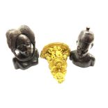 Pair of African carved ebony male and female heads H33cm and a painted plaster wall bracket W30cm