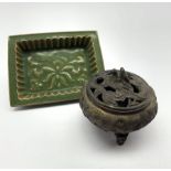 Oriental bronze koro with pierced dragon cover and seal mark to base D12cm and a green glazed rectan