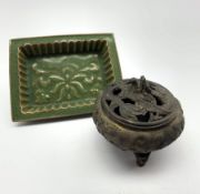 Oriental bronze koro with pierced dragon cover and seal mark to base D12cm and a green glazed rectan