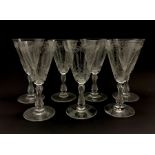 Set of seven early 20th century claret glasses decorated in the Baccarat style with foliate engraved