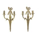 Pair late 20th Century gilt metal wall sconces, ruffled ribbon pediment on tapering husk stop fluted