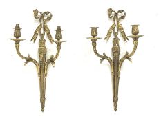 Pair late 20th Century gilt metal wall sconces, ruffled ribbon pediment on tapering husk stop fluted