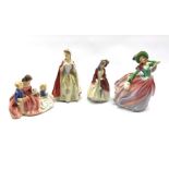 Four Royal Doulton figures comprising: Bess, Paisley Shawl, Bedtime Story and Autumn Breezes (4)