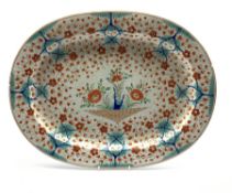 Early 19th century oval meat plate painted with Japanese flowers in orange and blue W52cm