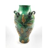 Chinese provincial wine vessel with ring handles, yellow leaves on a green ground H37cm