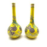 Pair of Japanese Meiji period bottle shaped vases decorated with Dragons amidst clouds and mon on ye