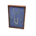 Set of Viking high status ladies personal jewellery mounted in a mahogany glazed display case, 61cm