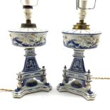 Pair of 19th century German blue and white porcelain 'oil' lamps, the reservoir relief moulded with