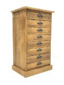 20th century light oak filing chest, fitted with eight drawers, raised on plinth base, W55cm, H94cm,