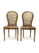 Pair French style berg�re chairs, moulded beech frames, curved cane work backs and serpentine seats,