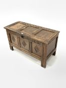 18th century oak coffer with triple panelled hinged lid and lozenge carved front on stile supports W