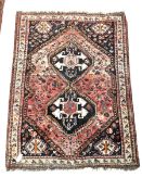 Persian design red ground rug, pole medallion enclosed by stylised decoration to border, 16cm x 116