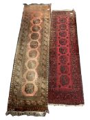 Persian design Bokhara runner rug, with gul motif on red field enclosed by multi line border, (81cm