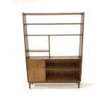 Mid 20th century teak room divider, fitted with open shelves and a cupboard, raised on turned suppor
