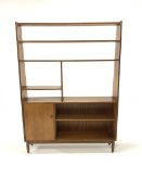 Mid 20th century teak room divider, fitted with open shelves and a cupboard, raised on turned suppor