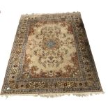 Persian design brown ground carpet, with floral medallion surrounded by interlaced foliate, double g