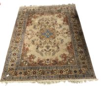 Persian design brown ground carpet, with floral medallion surrounded by interlaced foliate, double g