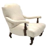 Victorian low upholstered open armchair, with swept arms, raised on turned front supports and castor