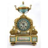 19th century French mantel clock, gilt metal with urn finial over case profusely decorated with a fl