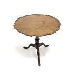 George III mahogany tripod table, circular moulded pie crust tilt top on turned column, three out sp
