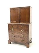 George II style cupboard on chest, the top section with two panel doors enclosing interior fitted wi