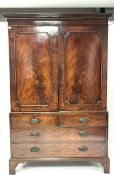 George III mahogany linen press with dentil cornice, the upper section with sliding trays and enclos