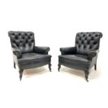 Pair of 19th century armchairs of generous proportions, upholstered in buttoned black leather, raise