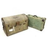 Early 20th century canvas covered dome top travelling trunk, with handle to each end and with old pa