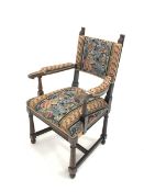 Waring & Gillow - Late 19th/Early 20th century carved oak open armchair, with needlework upholstered