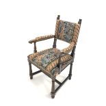 Waring & Gillow - Late 19th/Early 20th century carved oak open armchair, with needlework upholstered