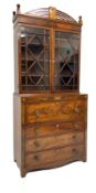 George III mahogany secretaire bookcase, the curved pierced pediment with centre satinwood plaque in