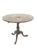 Georgian mahogany circular tilt top table, with turned column raised on triple splay supports and pa