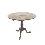 Georgian mahogany circular tilt top table, with turned column raised on triple splay supports and pa