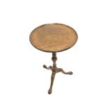 George III mahogany tripod table, circular moulded top on turned column, three out splayed supports