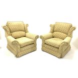 Pair armchairs upholstered in gold diamond fabric, with loose cushions, raised on castors, w93cm