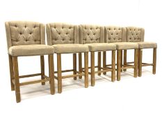 Set five contemporary breakfast stools, with natural linen buttoned upholstered backs, raised on pin