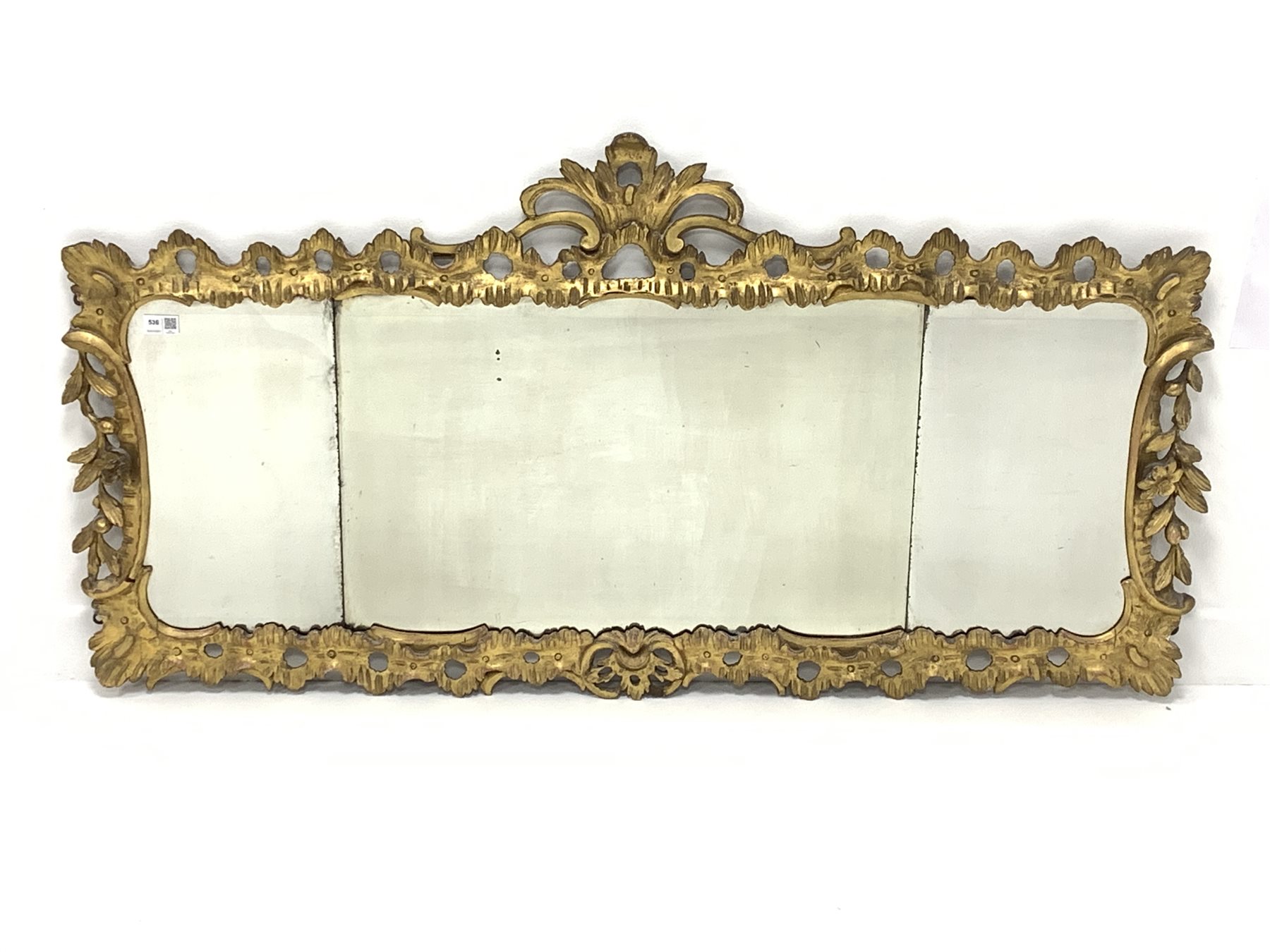 Mid 19th century giltwood wall mirror, with carved and pierced foliate enclosing three bevelled plat